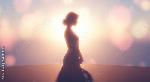 Elegant silhouette of a woman against a soft bokeh background with sunlight