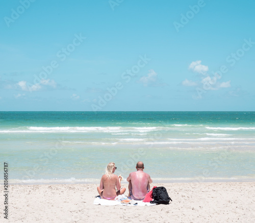 sunburnt couple beach miami florida