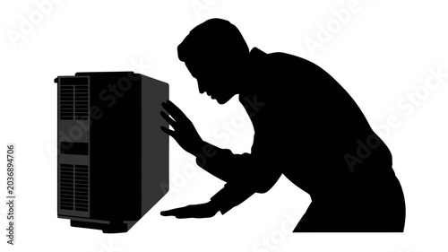 Silhouette of a man interacting with a computer tower