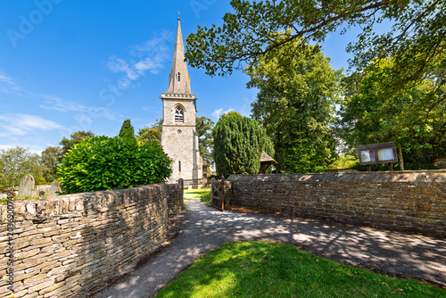 Bild auf Leinwand The historic Parish Church of Saint Mary in the picturesque English Village of Lower Slaughter, England, in the Cotswold District