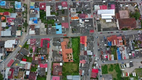 Top-down aerial drone hover over colorful Choachi rooftops and streets