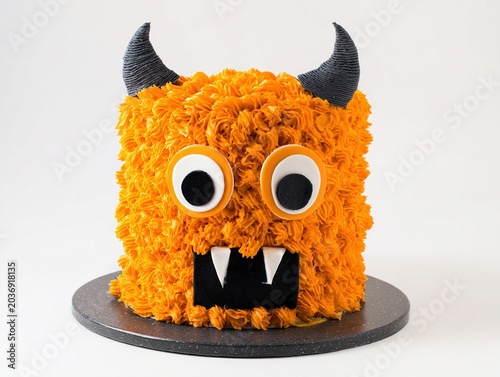 Creative Birthday Monster Cake with Horns Eyes and Textured Buttercream Design