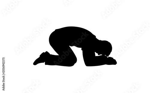 Silhouette of a person kneeling and bowing down on the floor in a prayer or meditation pose black shadow on white background focused calm spiritual atmosphere