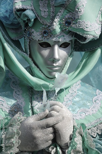 Portrait of turquoise green mask at carneval in Venice, Italy