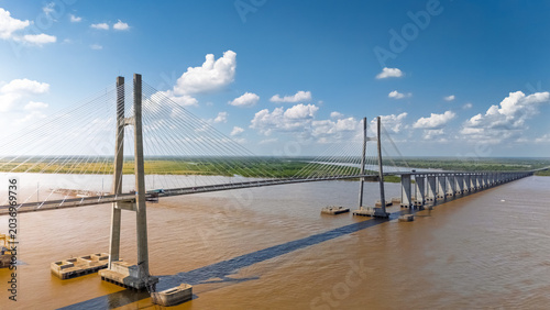 Schilderij op canvas Aerial view of the cable-stayed Rosario-Victoria Bridge spanning the wide Parana