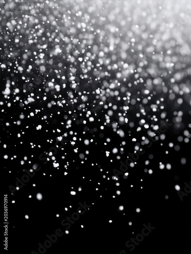 Beautiful snowflakes falling against a dark background, creating a serene winter vibe.