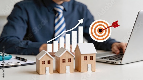 Real estate investment growth, property market success and financial profit concept with miniature wooden houses, rising bar graph arrow and target bullseye hit by red dart on