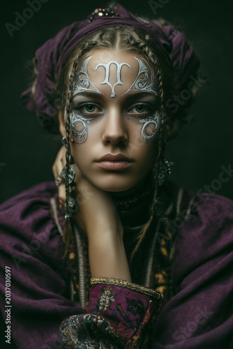 Portrait of a woman as an ethereal zodiac character with horns and jewels, fantasy beauty concept, mystical goddess