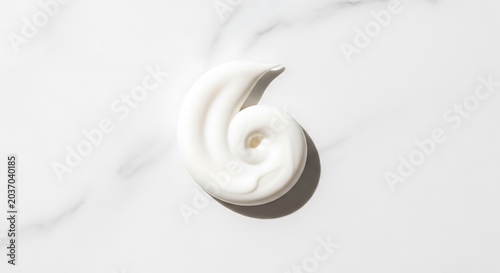 White cream swirl on white background.