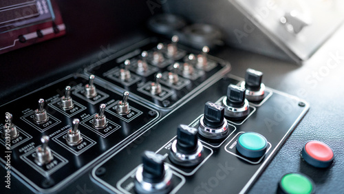 Quadro su tela Toggle switches, knob switches and buttons on the boat dashboard