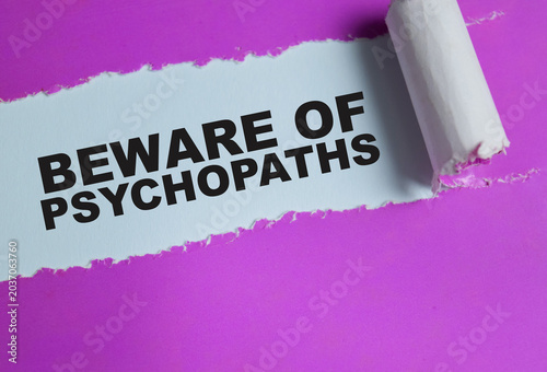 Obraz na płótnie Beware of psychopaths text written in torn paper