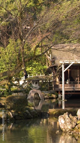 Traditional Teahouse and Stone Lantern at Kenrokuen Garden in Kanazawa Japan