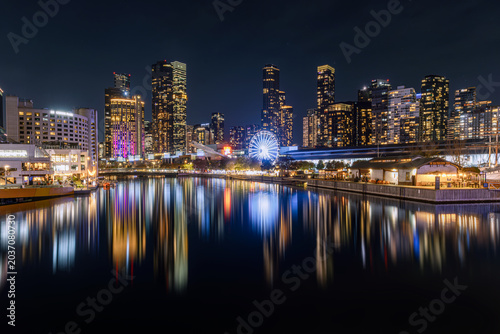 Bild auf Leinwand Yarra River reflections of the Melbourne CBD skyline at night, Brilliant urban l