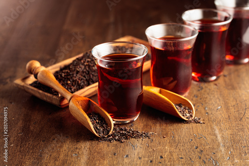 Black tea on an old wooden table.