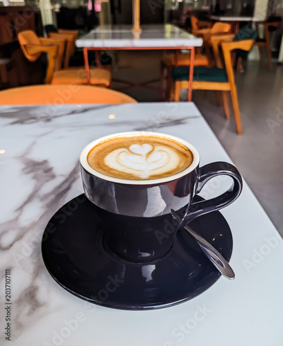 Cappuccino with latte art photographed from above