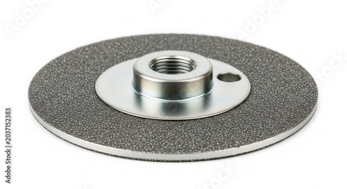 Close-up of a metal grinding disc with a threaded center for power tools.