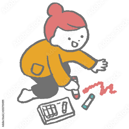 クレヨンでお絵描きをする女の子