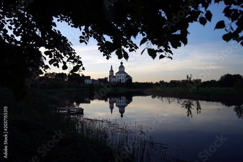 The lake reflects the building of an Orthodox church.