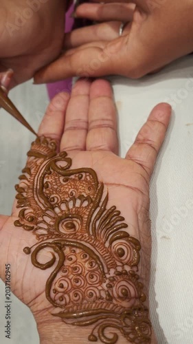 henna painting on hands