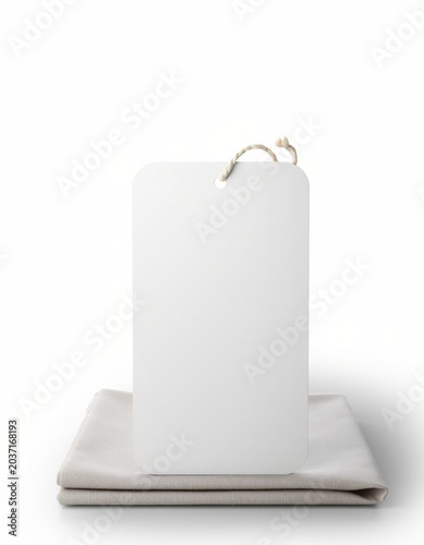 Blank hanging tag on folded fabric mockup