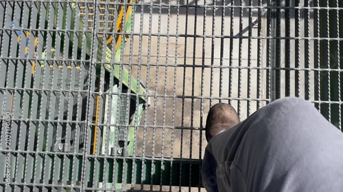 POV view walking on steel stairs and industrial structures inside a manufacturing facility, illustrating workplace inspection, engineering operations, and industrial infrastructure in a modern product