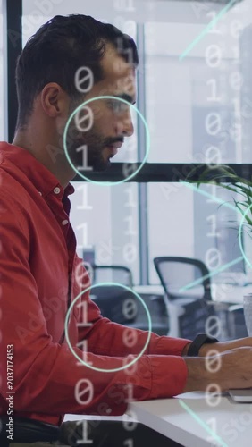Vertical video: IT pro typing laptop triggers binary and cyan nodes, taking notes for data analysis
