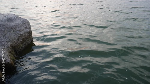 Clear blue water beside natural rock formation video