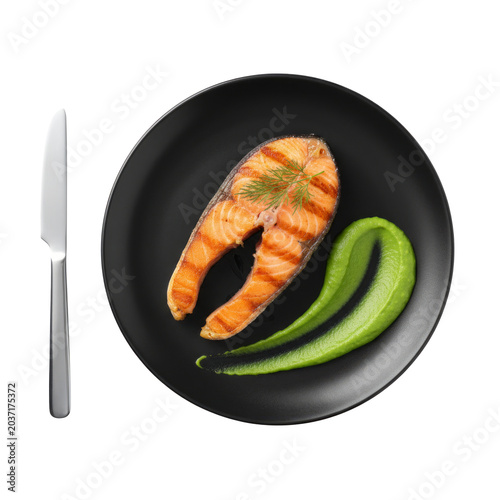 Grilled Salmon Steak With Green Purée And Dill Garnish On Black Plate