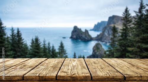 Wooden table mockup with dramatic coastal cliff landscape background