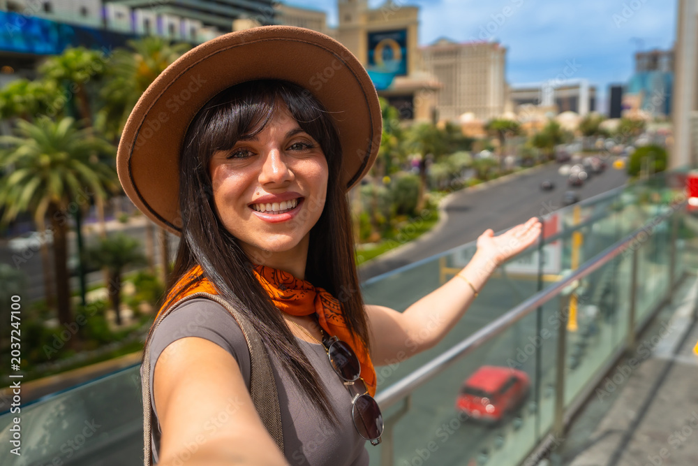 Fototapeta premium Happy woman tourist visiting las vegas city street