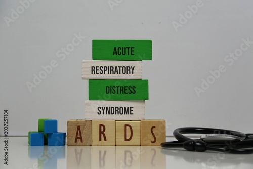Acute Respiratory Distress Syndrome (ARDS) Concept With Wooden Blocks And Stethoscope On white Background