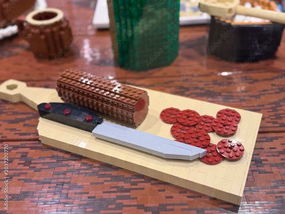 Obraz premium Lego knife with loaf on cutting board lego