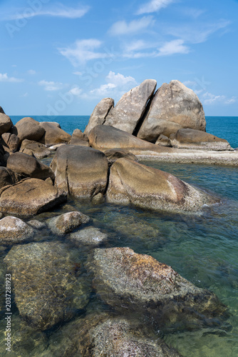 Beautiful tropical island with giant granite rock formations on the beach, crystal clear turquoise water
