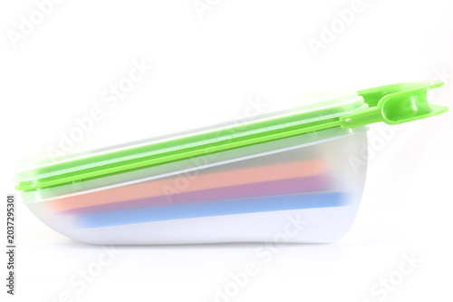 Canvas Print Side View of Multifunction Kitchen Grater Container, Side angle of a multifunction vegetable grater container with colorful storage layers isolated on white background for kitchen product catalogs