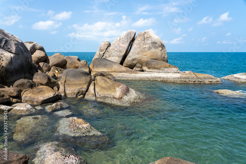 Beautiful tropical island with giant granite rock formations on the beach, crystal clear turquoise water