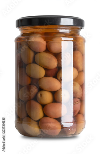 Nostraline olives, black olives with pits in a glass jar with screw cap. Whole, Italian table olives, with tapered shape and purple color, preserved in a brine of salt and vinegar. Front view. Photo