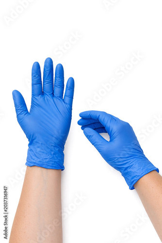 A human hand with blue latex gloves