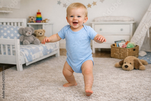 A joyful baby standing in a safe and clean playroom environment.