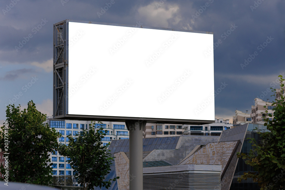 Fototapeta premium Advertising billboard along the road in the city. Background for design. 