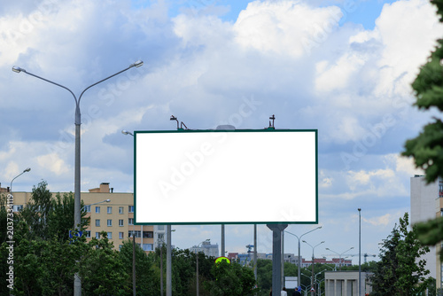 White billboard along the highway. Background for design and advertising.