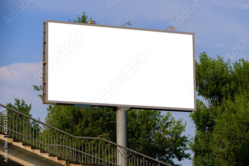 White billboard along the highway. Background for design and advertising.