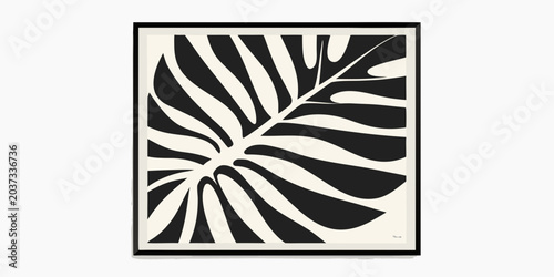 Photos Black and cream patterned leaf in a black frame
