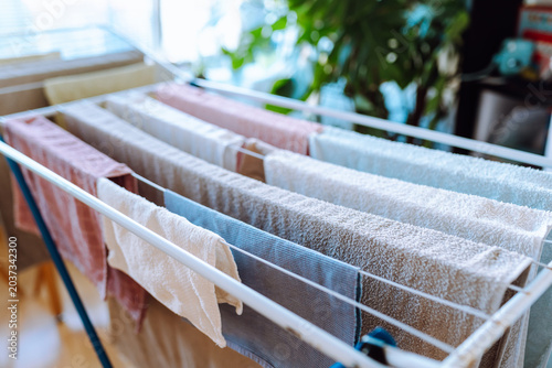 clothes are dried on a clothes dryer indoors