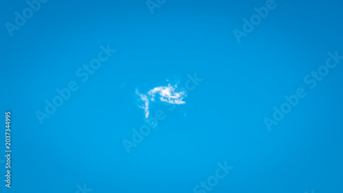 A Solitary Ethereal Cloud Floating In Cerulean Skies