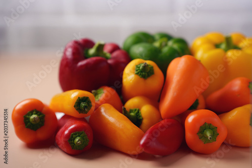 Canvas Print vibrant array of fresh red, green, yellow, and orange colored bell peppers on ne