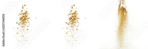 Obraz na plátně Dynamic sand or golden dust particles exploding and scattering in mid-air isolat