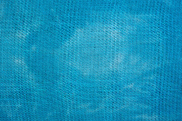 Macro tie dye fabric texture in blue tones