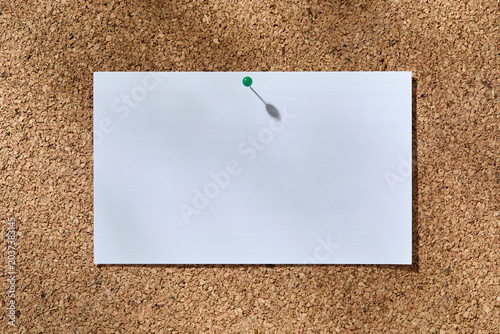 Blank white notecard on corkboard