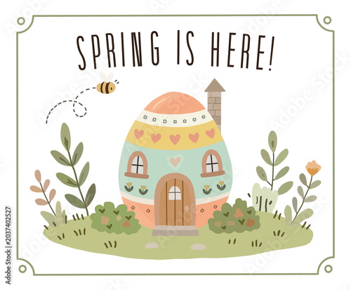 Cute fairytale Easter egg house surrounded by spring garden with a flying bumblebee and 
