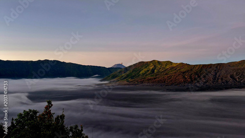 Εκτύπωση καμβά Soft sunrise colors illuminating the sea of clouds around Mount Bromo in East Java, Indonesia